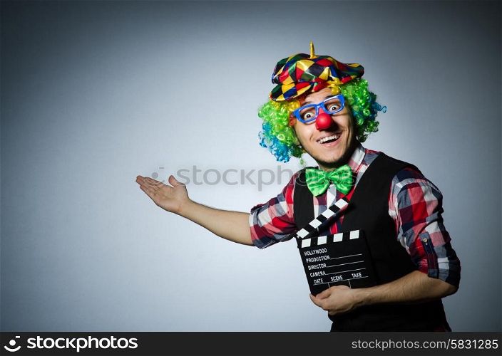 Clown with the movie board
