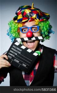 Clown with the movie board