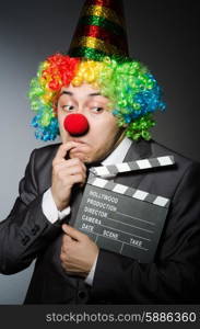 Clown with the movie board