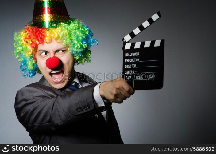 Clown with the movie board