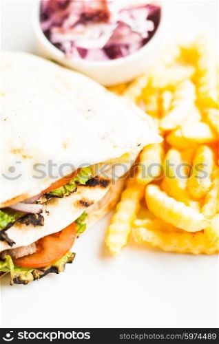 Club sandwich in pita with fried potato and salad. Club sandwich