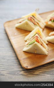 Club sandwich with on wood background