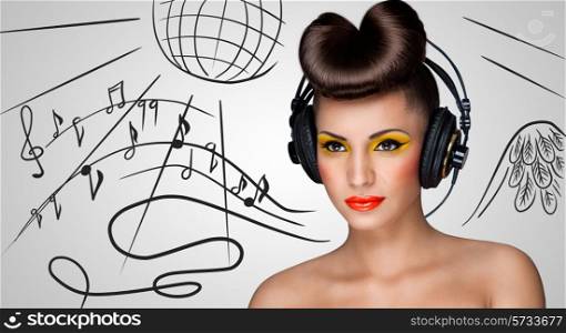Clubbing fashionable girl at the nightclub with big vintage headphones on grey sketchy background of a disco ball and flowing music notes.