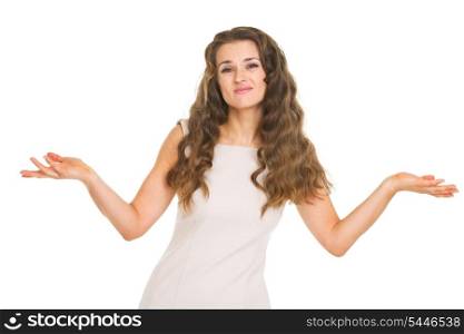 Clueless young woman shrugging shoulders