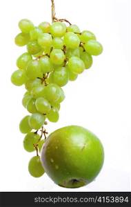 Cluster of grapes in water drops And apple