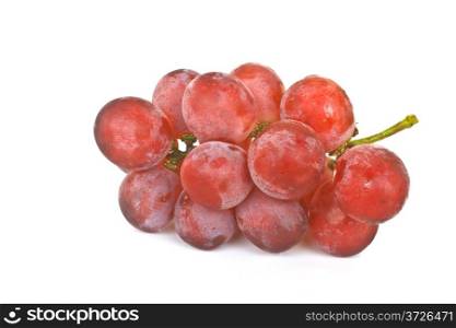 Cluster of ripe juicy red grapes on a white background