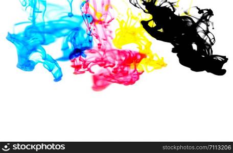 cmyk ink concept color splash for paint with cyan blue red magenta yellow and black / Rainbow ink drop Acrylic colors in water on white background , blur and selective focus