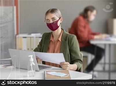 co workers wearing face mask work