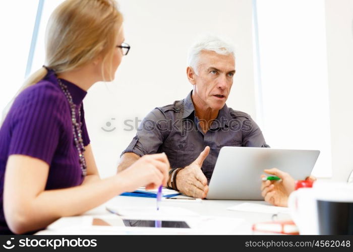 Co-workers working together. Business team working together in office