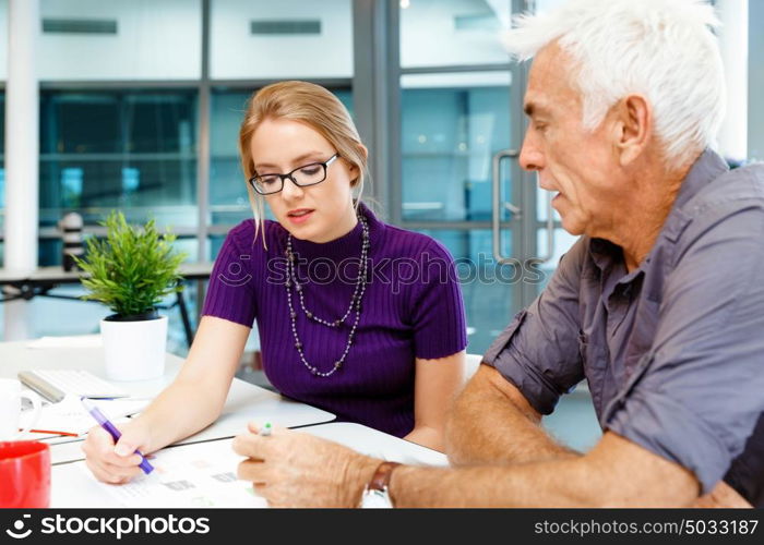 Co-workers working together. Business team working together in office