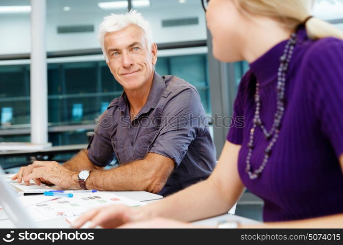 Co-workers working together. Business team working together in office