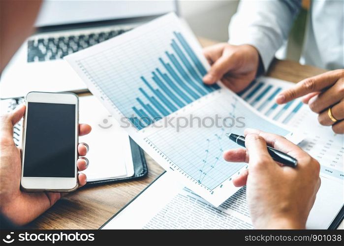 Co-working Business Team meeting Planning Strategy Analysis investment and saving concept. meeting discussing new plan financial graph data.