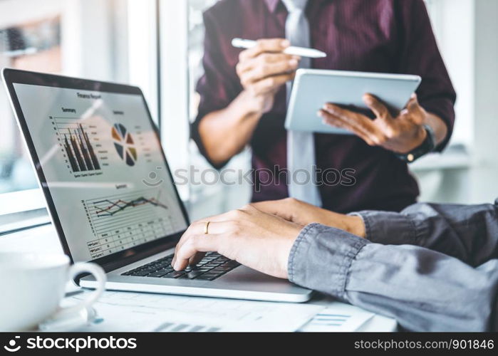 Co-working Business Team meeting Planning Strategy Analysis investment and saving concept. meeting discussing new plan financial graph data on Laptop.