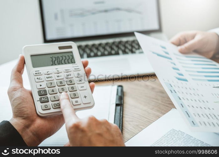 Co-working Business Team meeting Planning Strategy Analysis investment and saving concept. meeting discussing new plan financial graph data on Laptop.