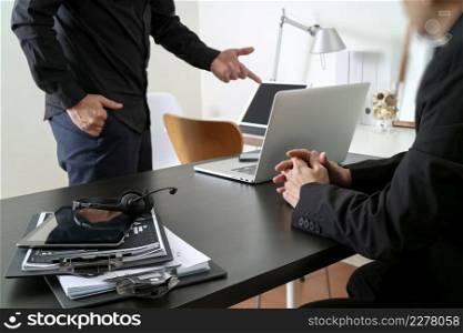 co working meeting,two businessman using VOIP headset with latop computer on desk in modern office as call center and customer service help desk concept 