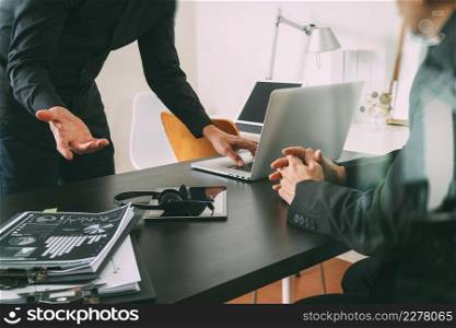 co working meeting,two businessman using VOIP headset with latop computer on desk in modern office as call center and customer service help desk concept 