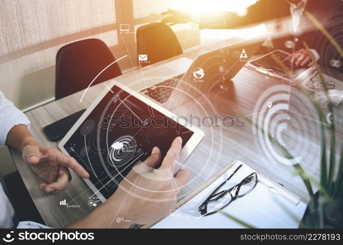co working team meeting concept,businessman using mobile phone and digital tablet and laptop computer in modern office with virtual icon diagram