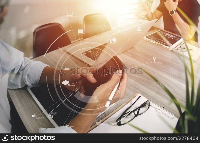 co working team meeting concept,businessman using mobile phone and digital tablet and laptop computer in modern office with virtual icon diagram