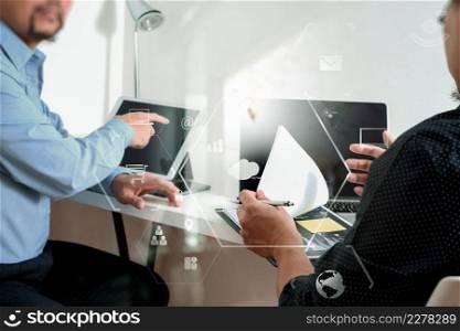 co working team meeting concept,businessman using smart phone and digital tablet and laptop computer in modern office with virtual icon graph and chart