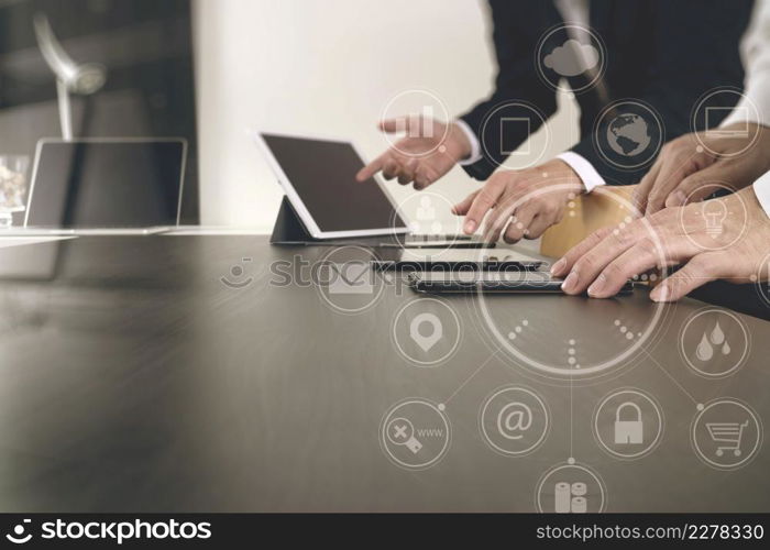 co working team meeting concept,businessman using smart phone and digital tablet and laptop computer in modern office with virtual icon diagram