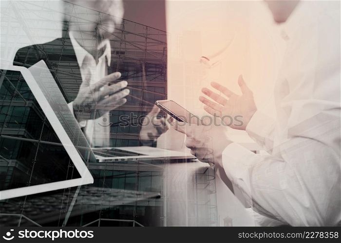Co working team meeting concept,businessman using smart phone and digital tablet and laptop computer in modern office with London city exposure