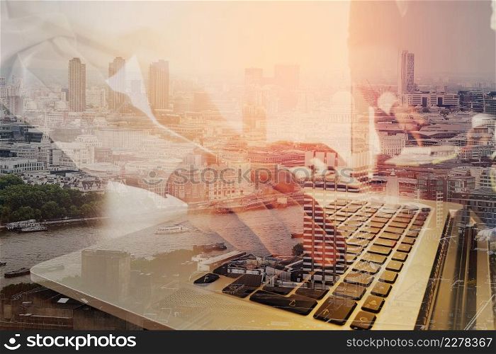 co working team meeting concept,businessman using smart phone and laptop and digital tablet computer in modern office with London city exposure