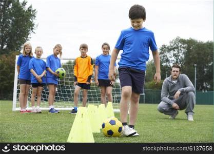 Coach Leading Outdoor Soccer Training Session