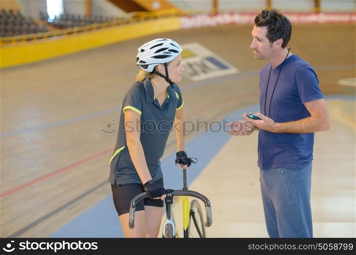 Coach motivating cyclist