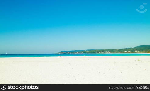 Coast and beach in Vada, Italy. Transparent, turquoise water and white sand. Travel and nature concept.. Coastal area in Vada, Tuscany, Italy.