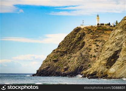 Coast landscape with Carchuna lighthouse. Costa tropical, Granada. Andalucia Spain. Tourist attraction.. Spanish coast with Carchuna lighthouse