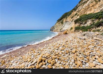 Coast landscape with stony beach, mountain and blue sea in Kefalonia Greece