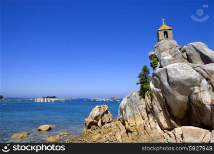 Coast of France in Brittany, the famous small chapel at the rocks in Port-Blanc