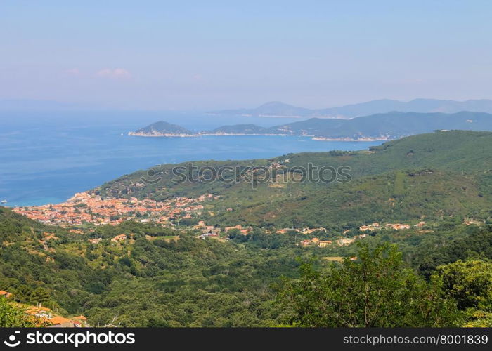 Coast of Tyrrhenian Sea on Elba Island, Italy. Panorama of Marciana Marina. View from Marciana.