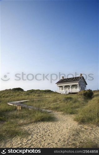 Coastal house with pathway to beach on Bald Head Island, North Carolina.