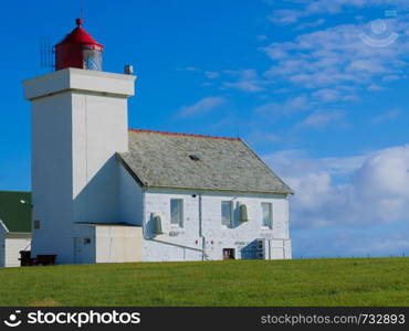 Coastal landscape. Obrestad lighthouse in south Norway, Norwegian national tourist county route road 44 Jaeren.. Obrestad lighthouse in Norway.