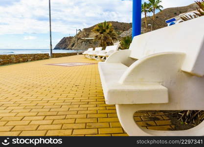 Coastal landscape with seaside promenade in spanish resort village. Carchuna beach. Costa tropical, province Granada. Andalucia Spain.. Carchuna Beach, Andalucia Spain