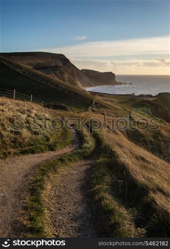 Coastal path landscace at sunrise on Jurassic Coast England