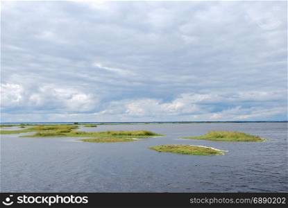 Coastal wetland with small green islands by the coast of the swedish island Oland in the Baltic Sea