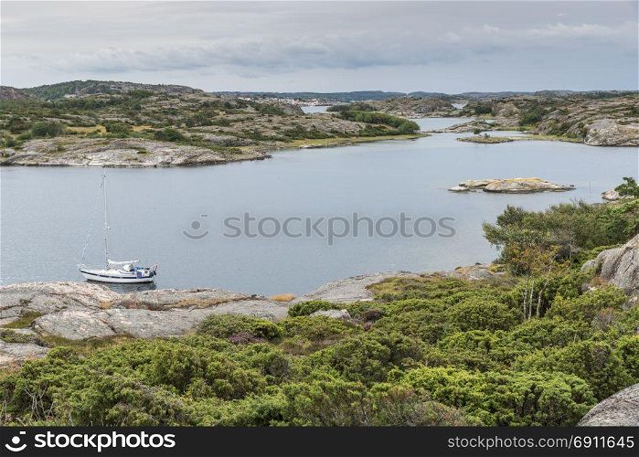 coastline in sweden above fjallbacka with boats and sea as background