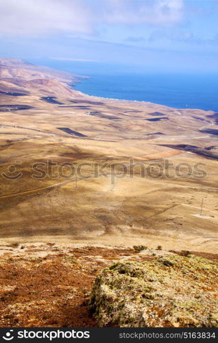 coastline lanzarote view from the top in spain africa and house field