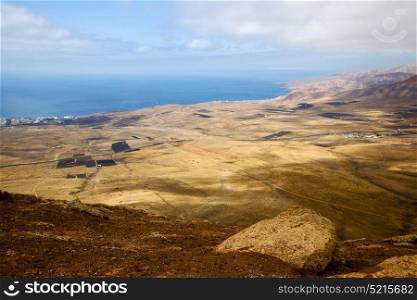 coastline lanzarote view from the top in spain africa and house field