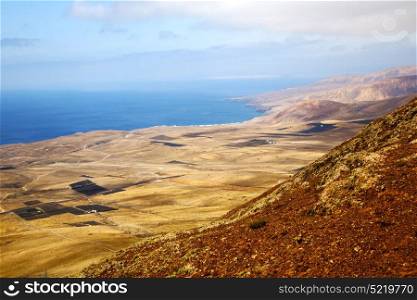 coastline lanzarote view from the top in spain africa and house field