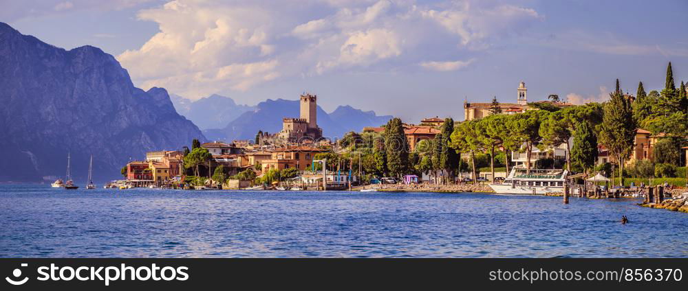 Coastline of lago di garda: Blue water and little village Malcesine