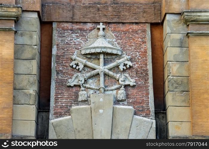 Coat of arms on the ancient gate Galliera (Porta Galliera) in Bologna, Italy