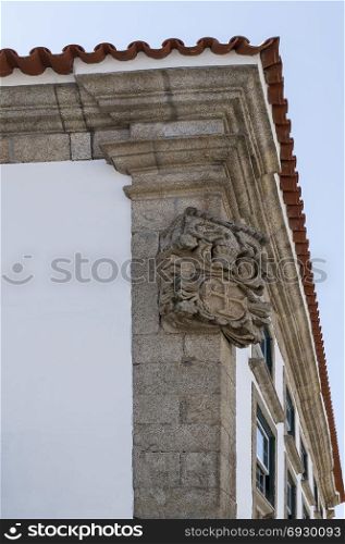 Coat of arms on the corner of a building in Braganca, Portugal