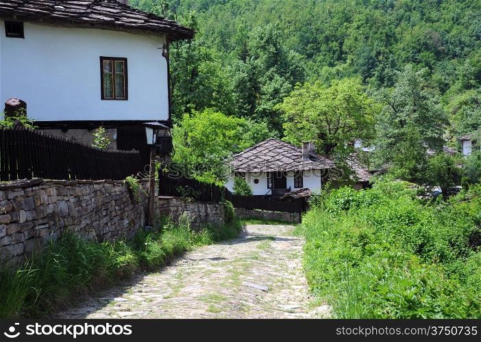 Cobbled street in old Bozhentsi village in Bulgaria