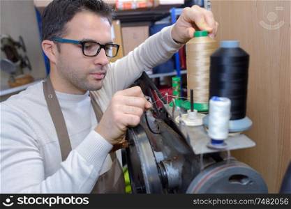 cobbler and his stitching machine