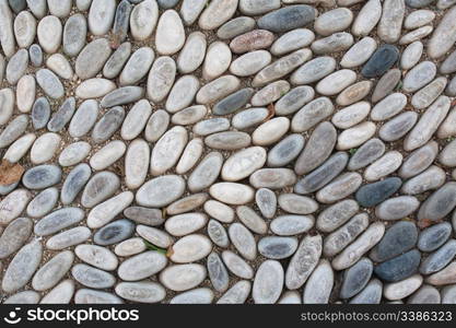 Cobblestone background: floor in a medieval alley in Rhodes Old Town, Greece.