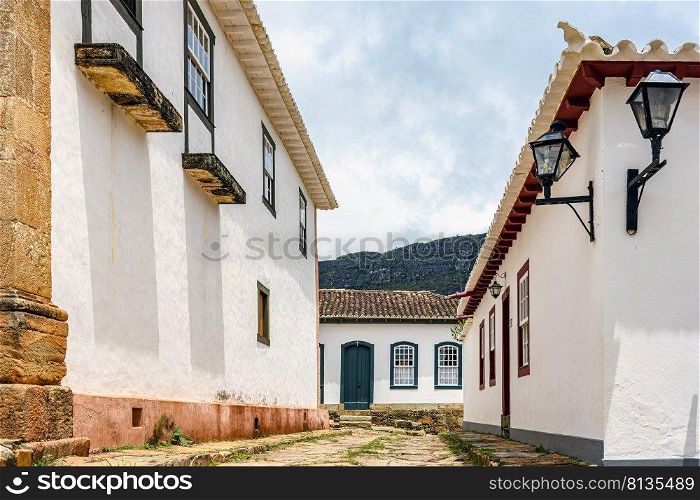Cobblestone street in the historic city of Tiradentes in Minas Gerais among old colonial style houses. Cobblestone street in the historic city of Tiradentes