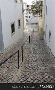 Cobblestoned street in Albufeira, El Algarve, Portugal.